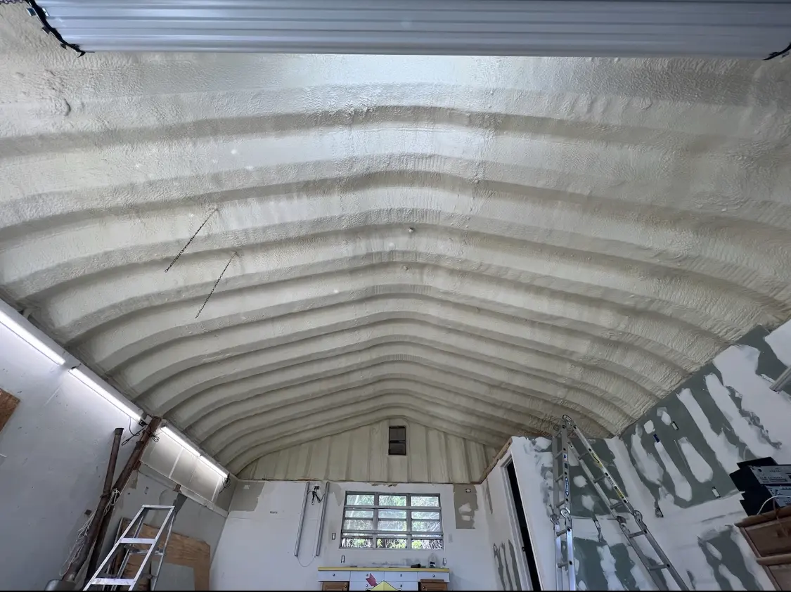 Spray polyurethane foam applied to the underside of a metal roof deck in Oroville